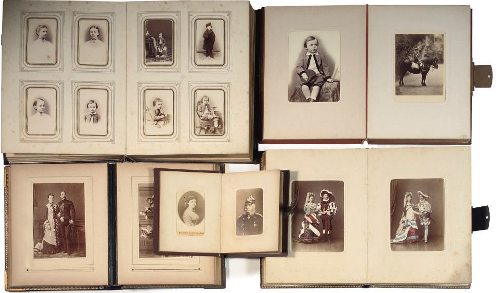 Five metal mounted photo albums