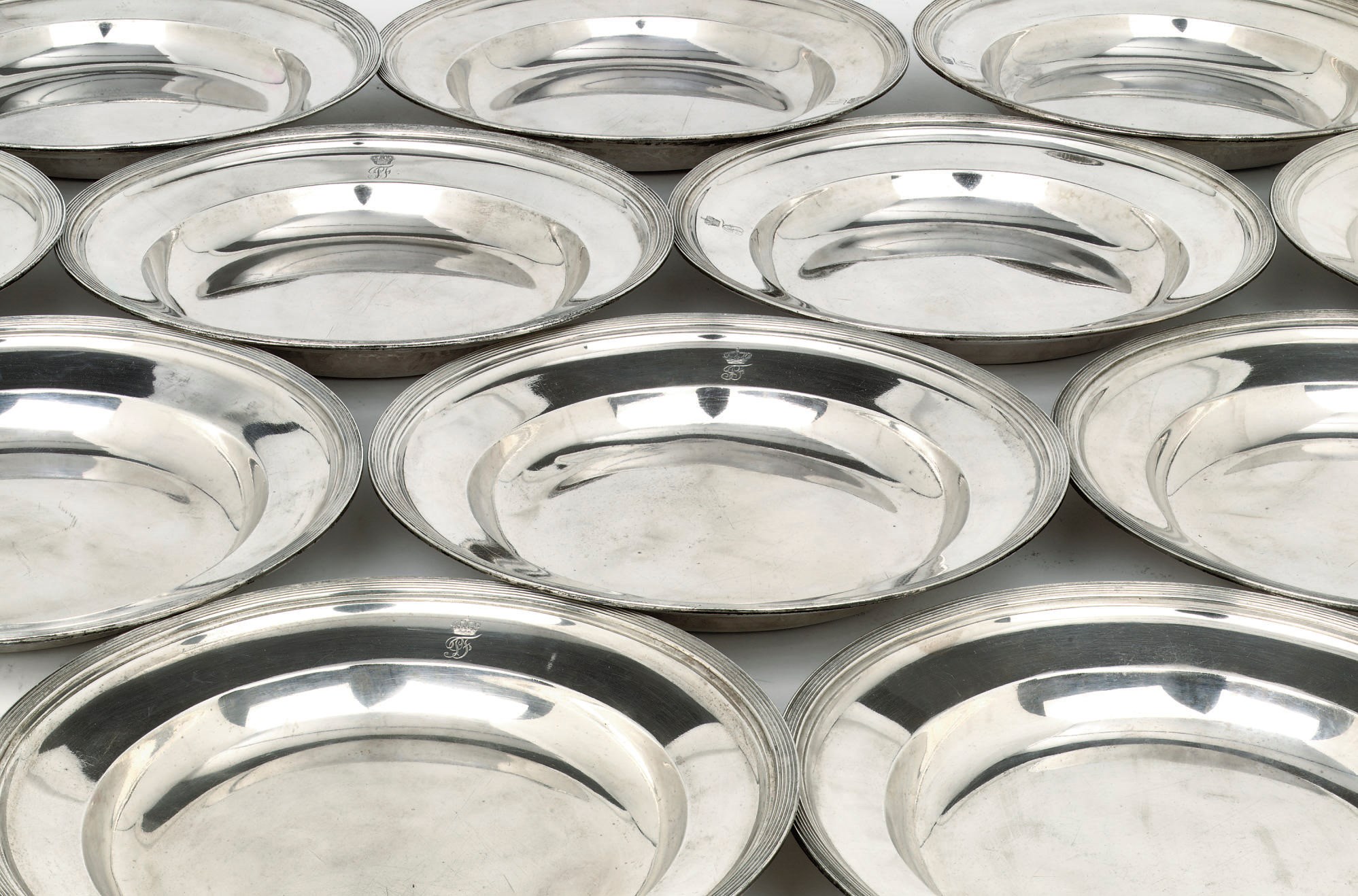 A rare set of twelve Dutch Royal silver soup-plates