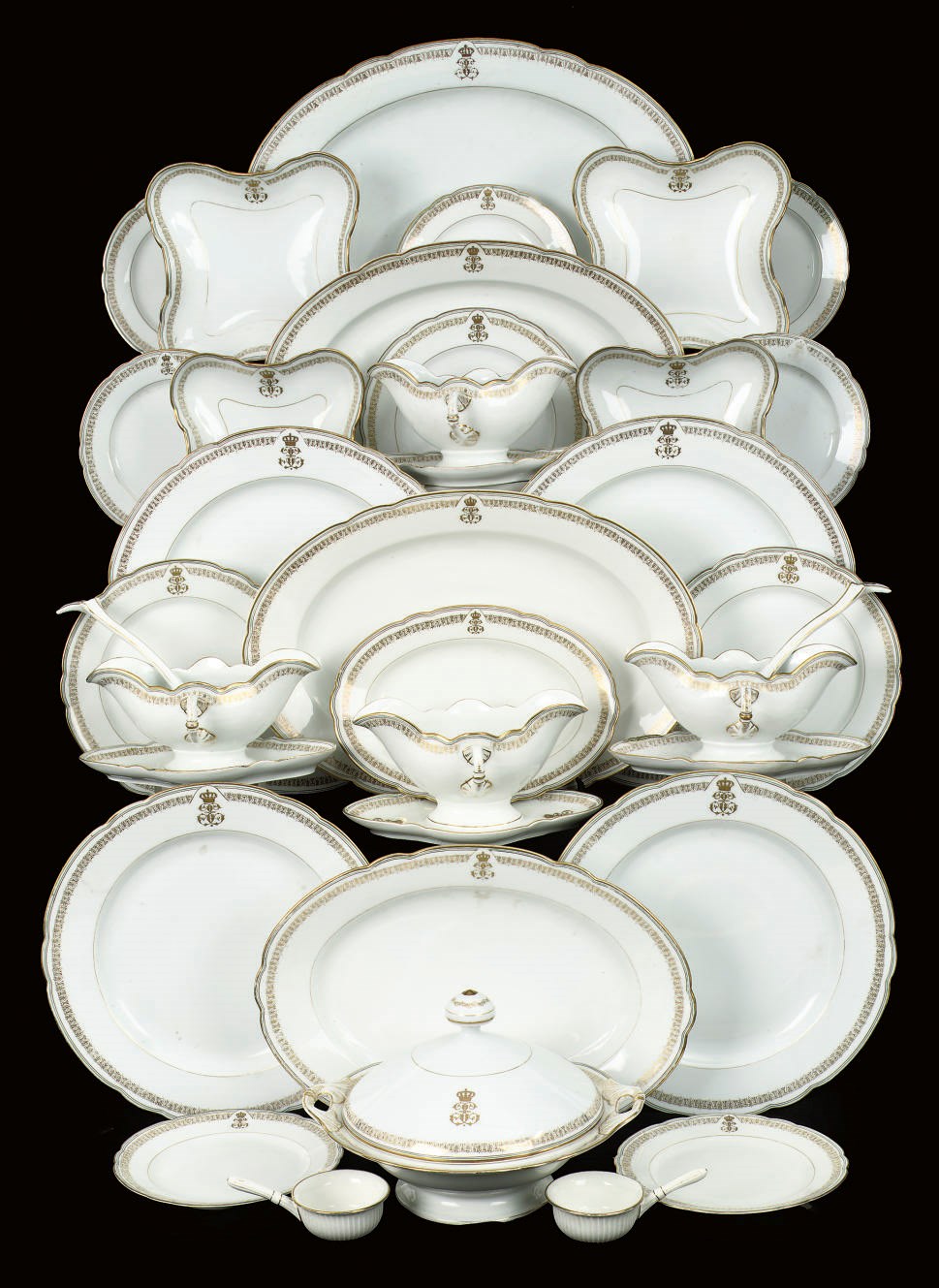 A Royal German white and gilt assembled porcelain part dinner service