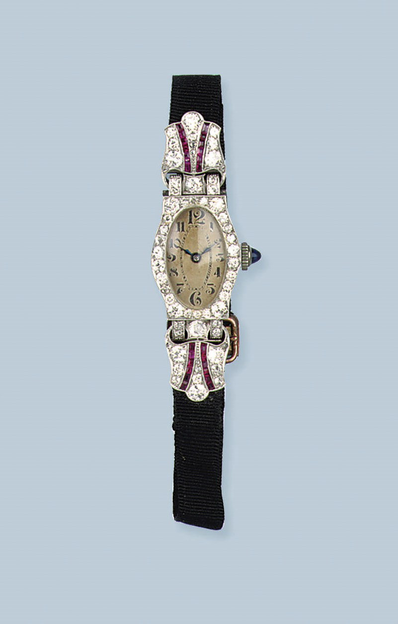A FINE PLATINUM BELLE EPOQUE RUBY AND DIAMOND BRACELET WATCH AND A STEEL PENDANT WATCH