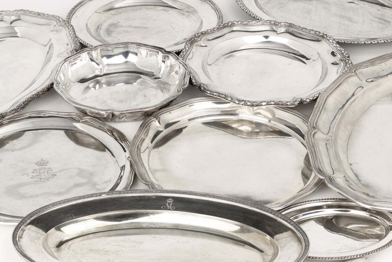 A group of silver serving dishes