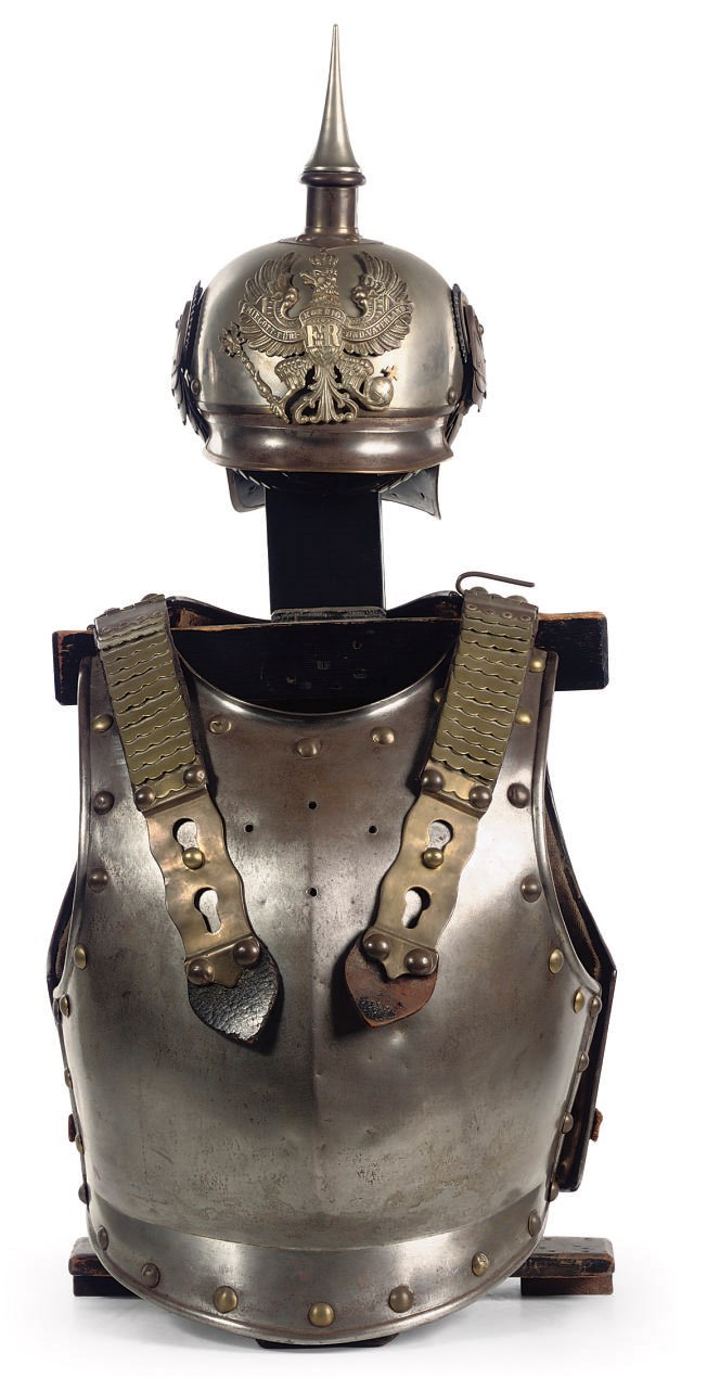 A German Steel brass and copper helmet 'Pickelhaube' and cuirass