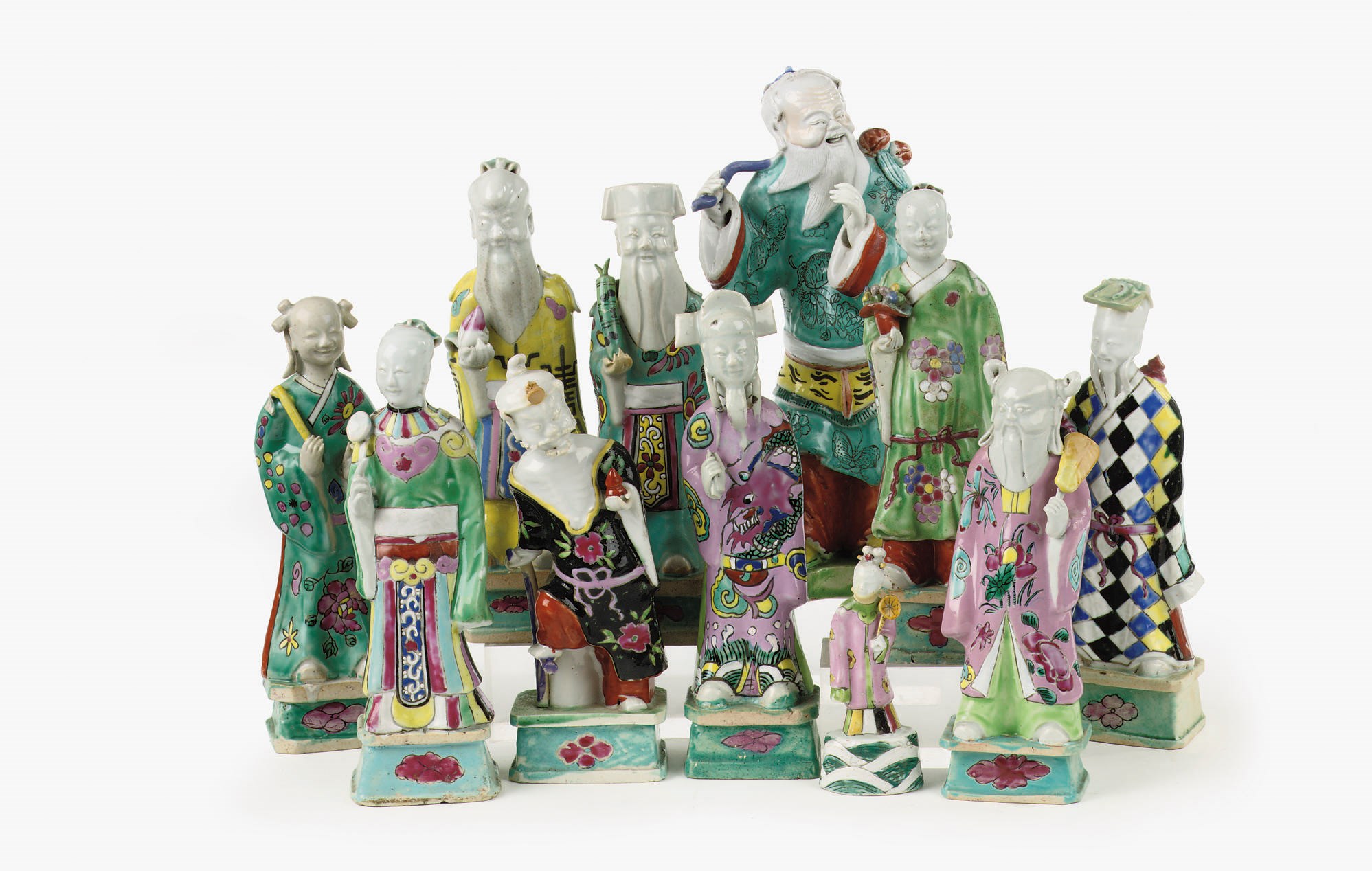 A set of nine and two Chinese famille rose figures of Immortals