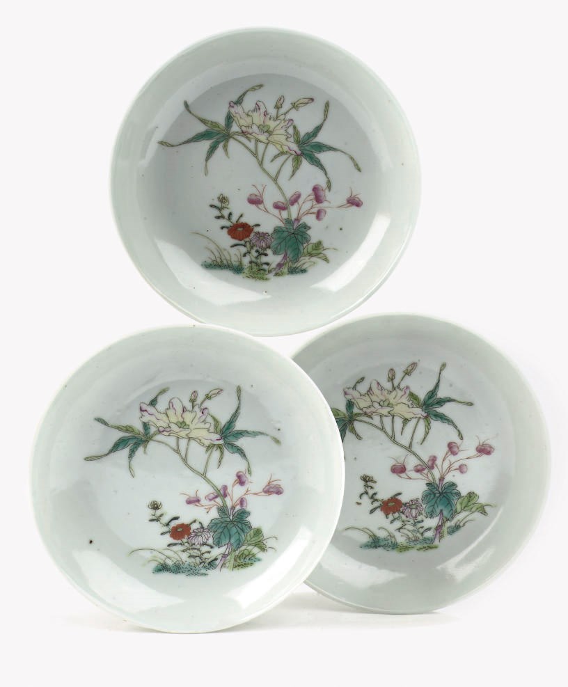 A set of three Chinese famille rose saucer dishes