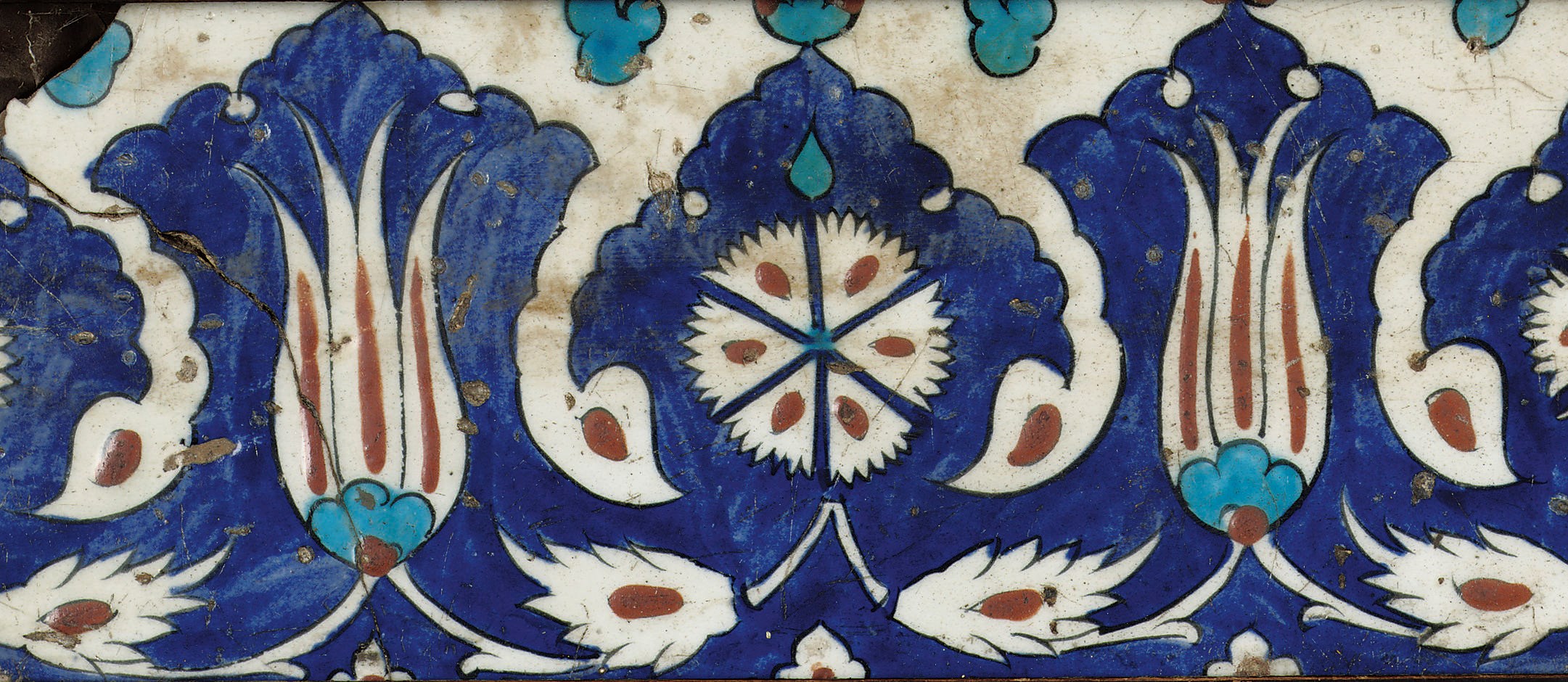 An Iznik polychrome framed pottery tile