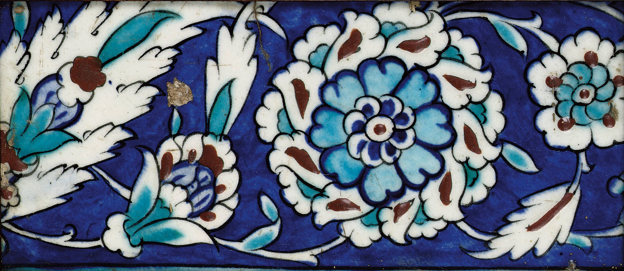 An Iznik polychrome framed pottery tile