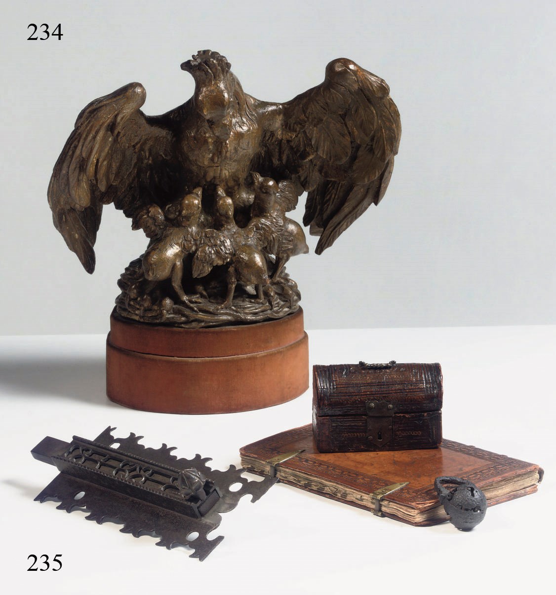 A GILT CARVED WOOD GROUP OF A PELICAN AND HER CHICKS ALEGORICAL OF CHARITY
