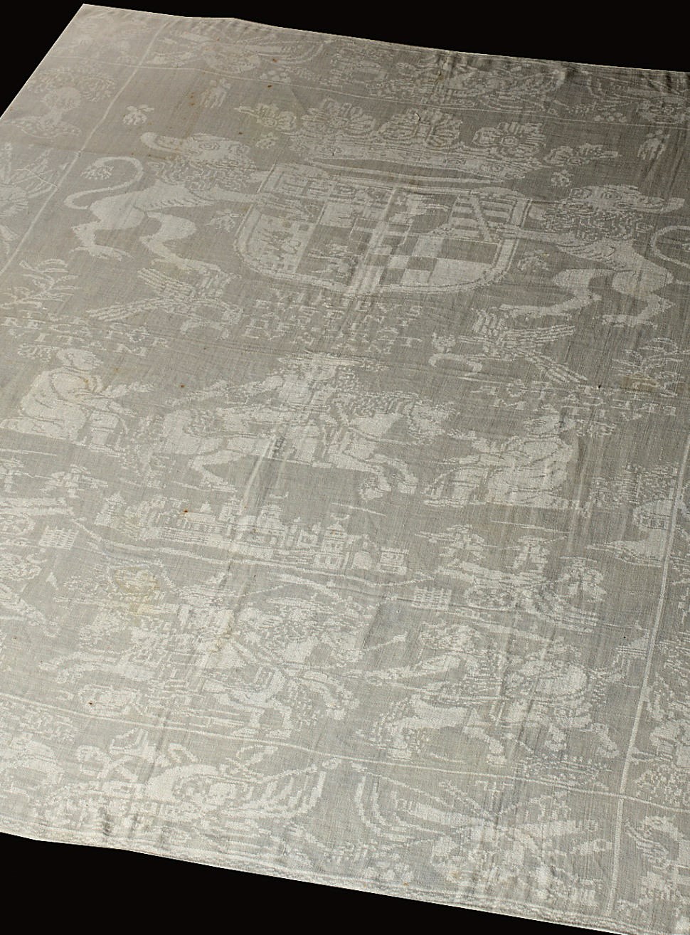 A DAMASK LINEN NAPKIN DEPICTING THE CAPTURE OF BELGRADE BY PRINCE EUGEN OF SAVOYE