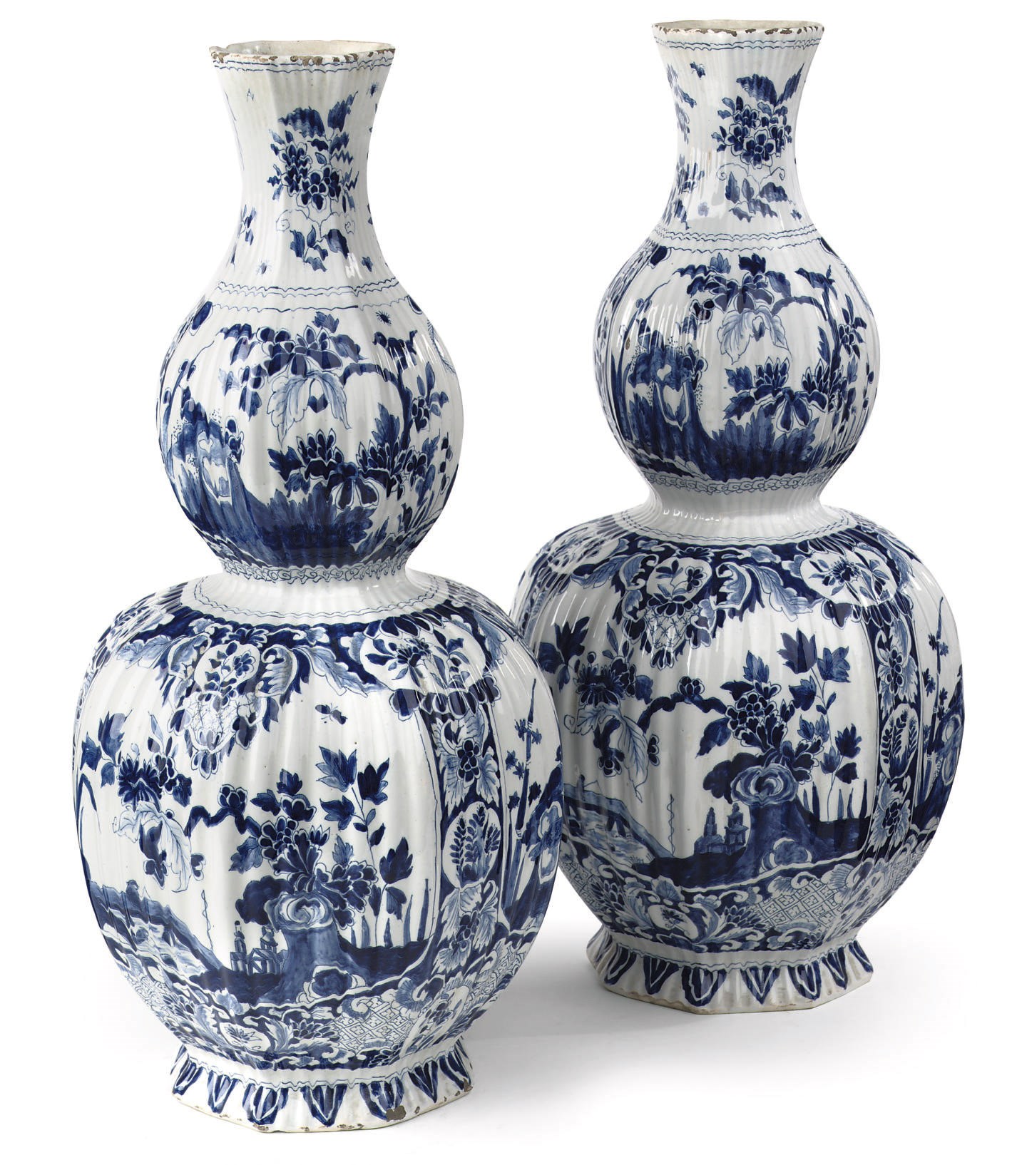 A pair of Dutch Delft blue and white ribbed double gourd vases
