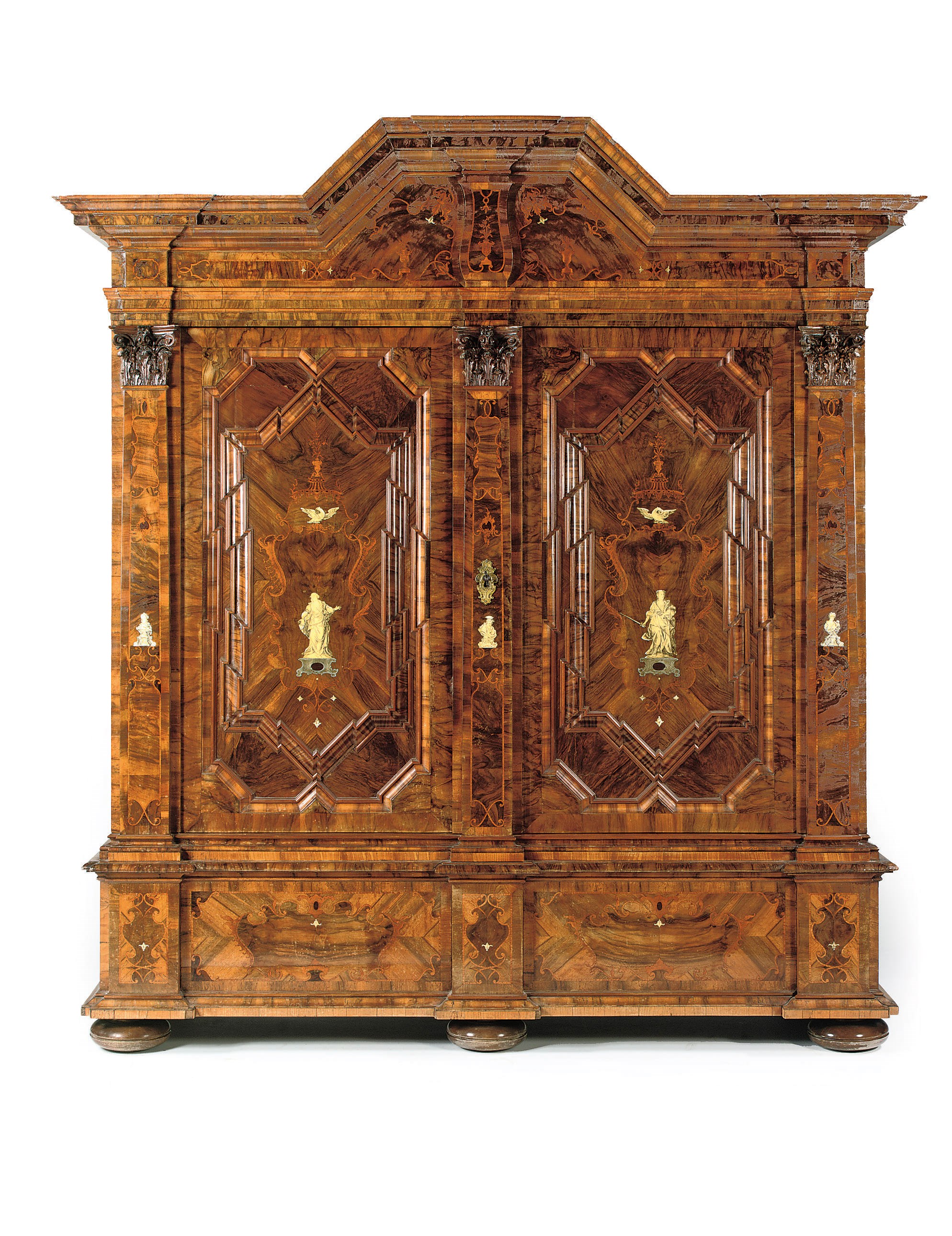 A German walnut, burr-walnut, ash, fruitwood, pewter and ivory inlaid cupboard
