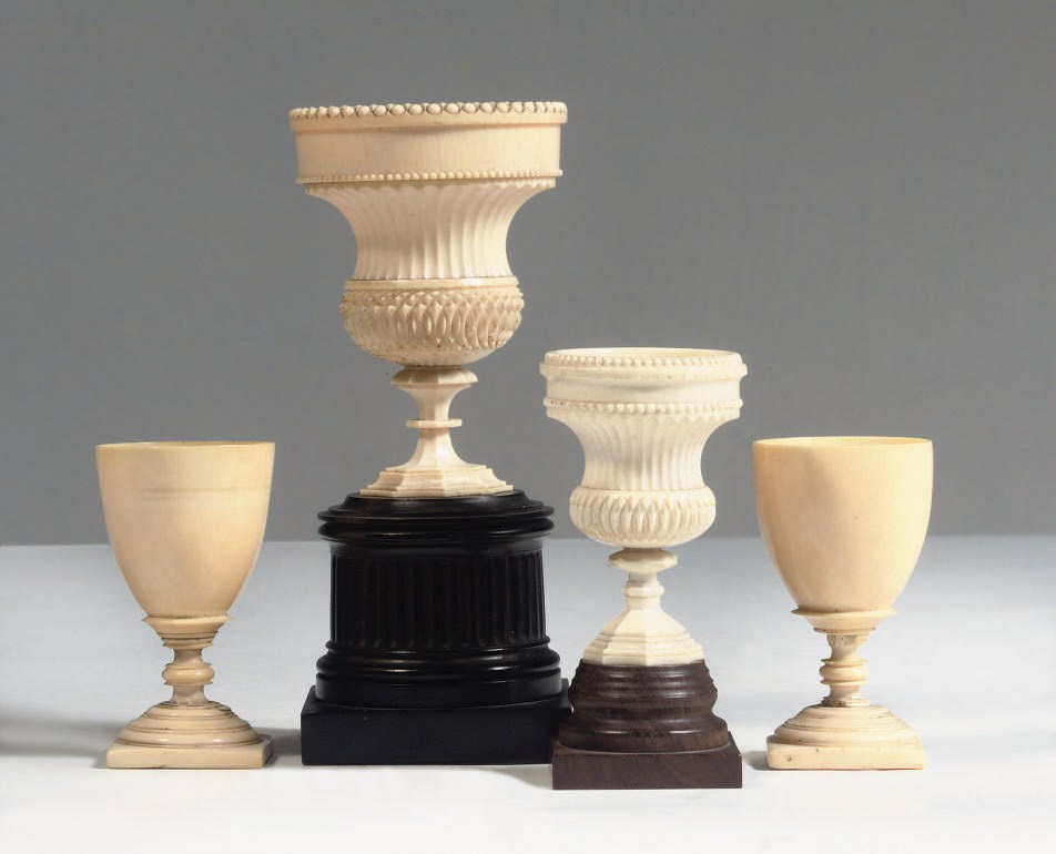 TWO ENGLISH IVORY, EBONY AND POCKWOOD BEAKERS