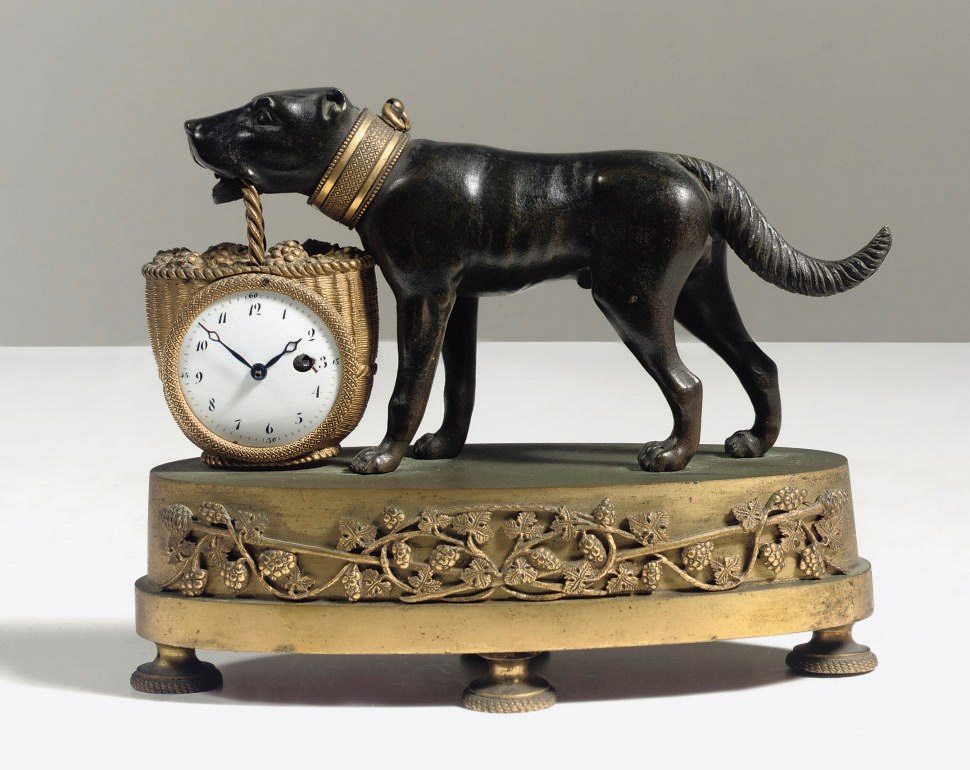 AN EMPIRE ORMOLU AND PATINATED BRONZE FIGURAL 'PENDULETTE' TIMEPIECE