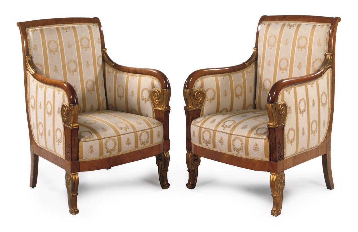 A PAIR OF BIEDERMEIER PARCEL-GILT AND BIRCH BERGERES