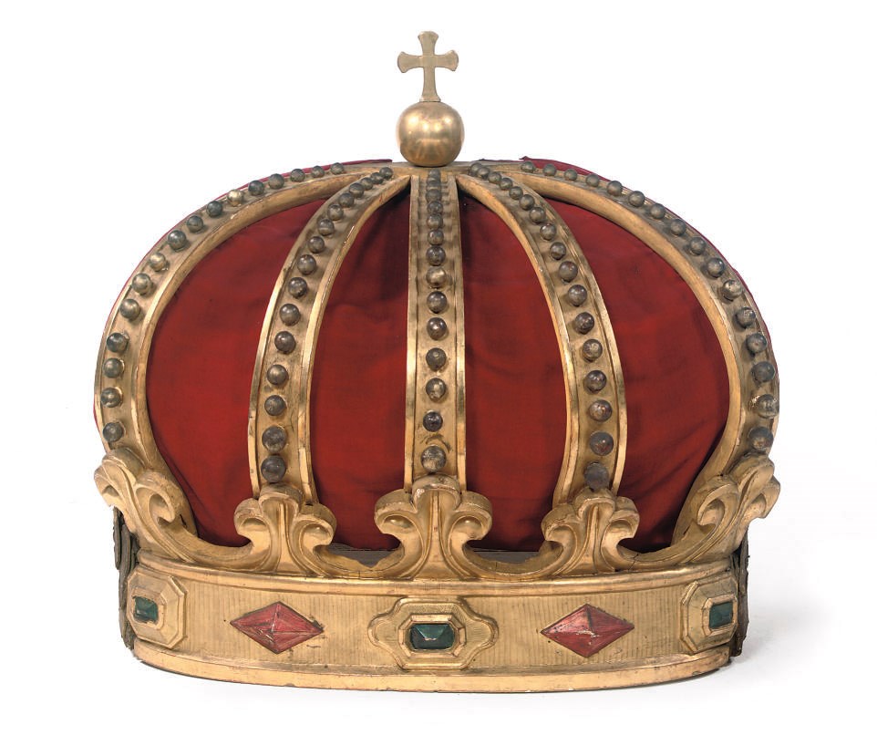 A GERMAN CARVED AND GILTWOOD CRESTING OF A CANOPY