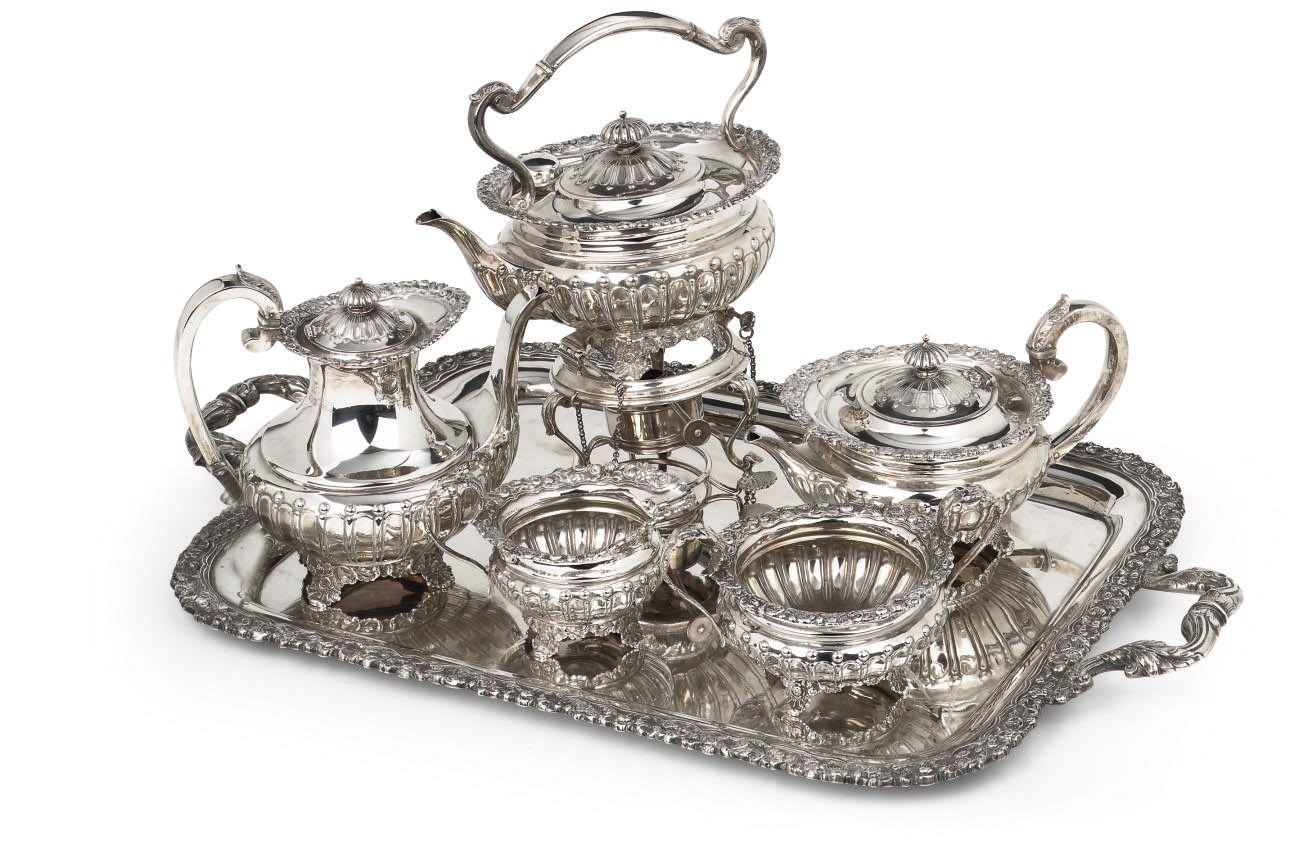An English silver tea-service on tray