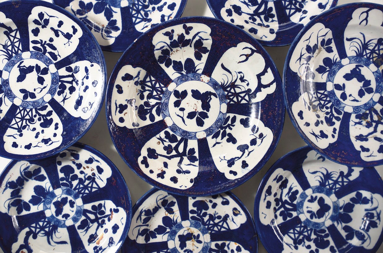 A set of eight Ansbach blue and white and gilt dishes