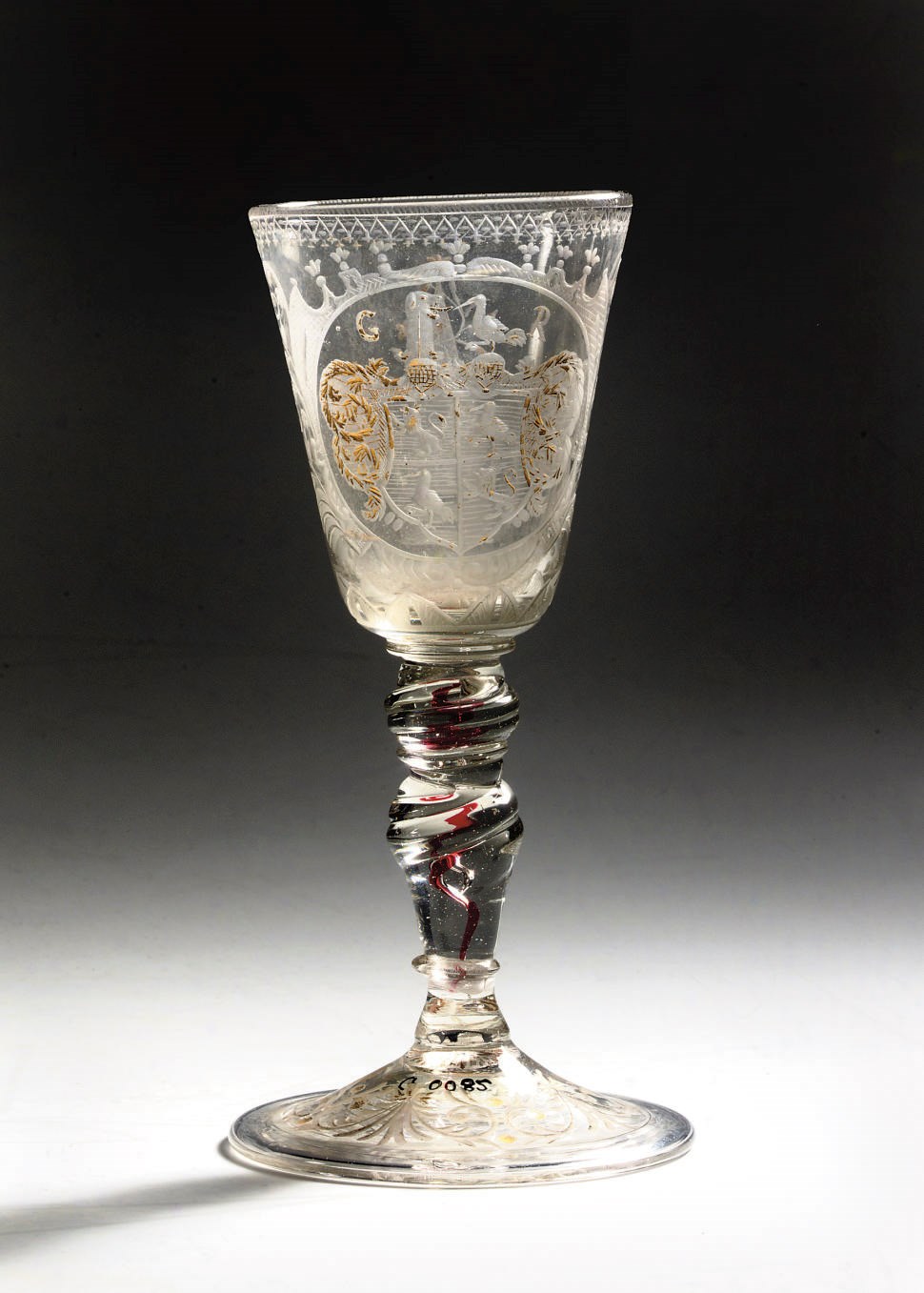 An engraved armorial goblet