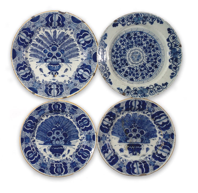 Three Dutch Delft blue and white peacock dishes and a blue and white Dutch Delft dish