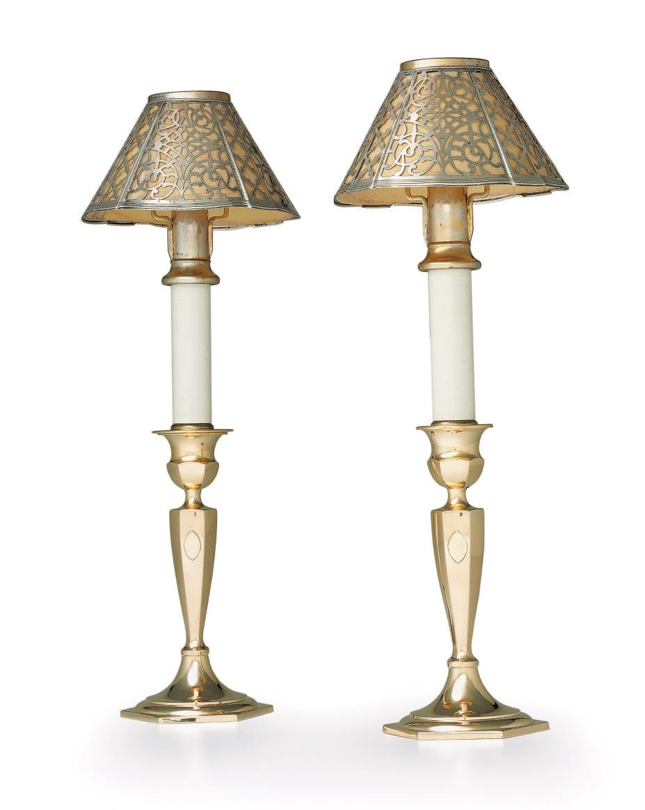 A PAIR OF GOLD CANDLESTICKS