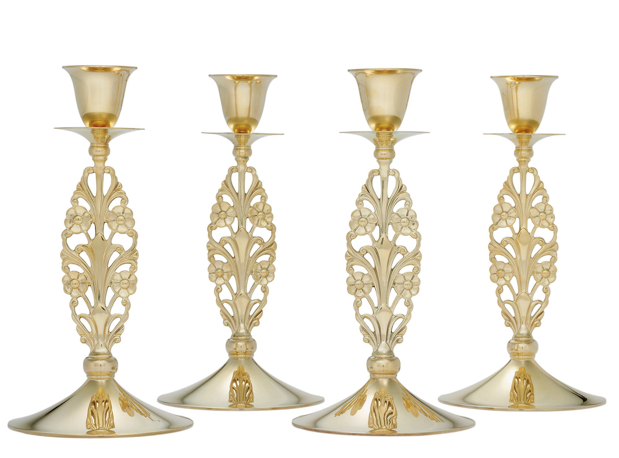 A SET OF FOUR SILVER-GILT CANDLESTICKS