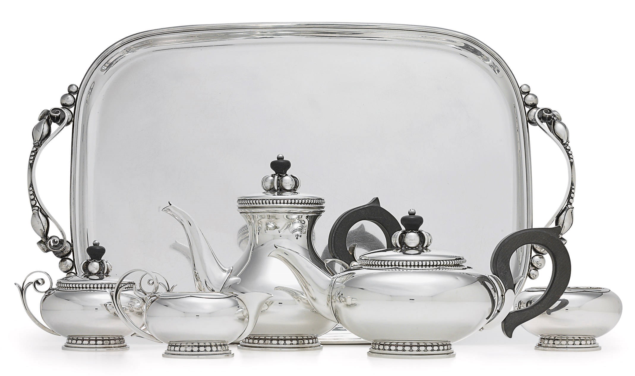 A FIVE-PIECE SILVER TEA AND COFFEE SERVICE WITH TRAY
