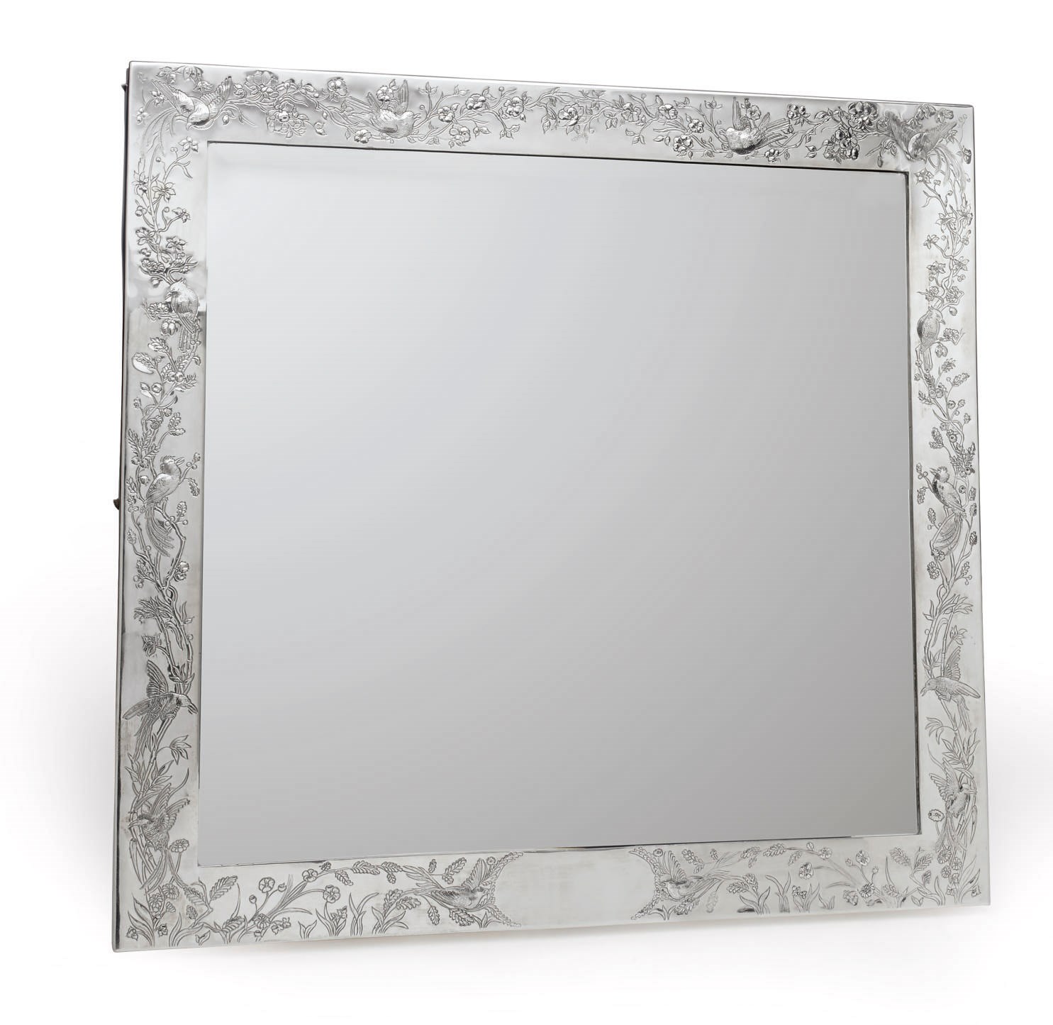A SILVER-MOUNTED MIRROR