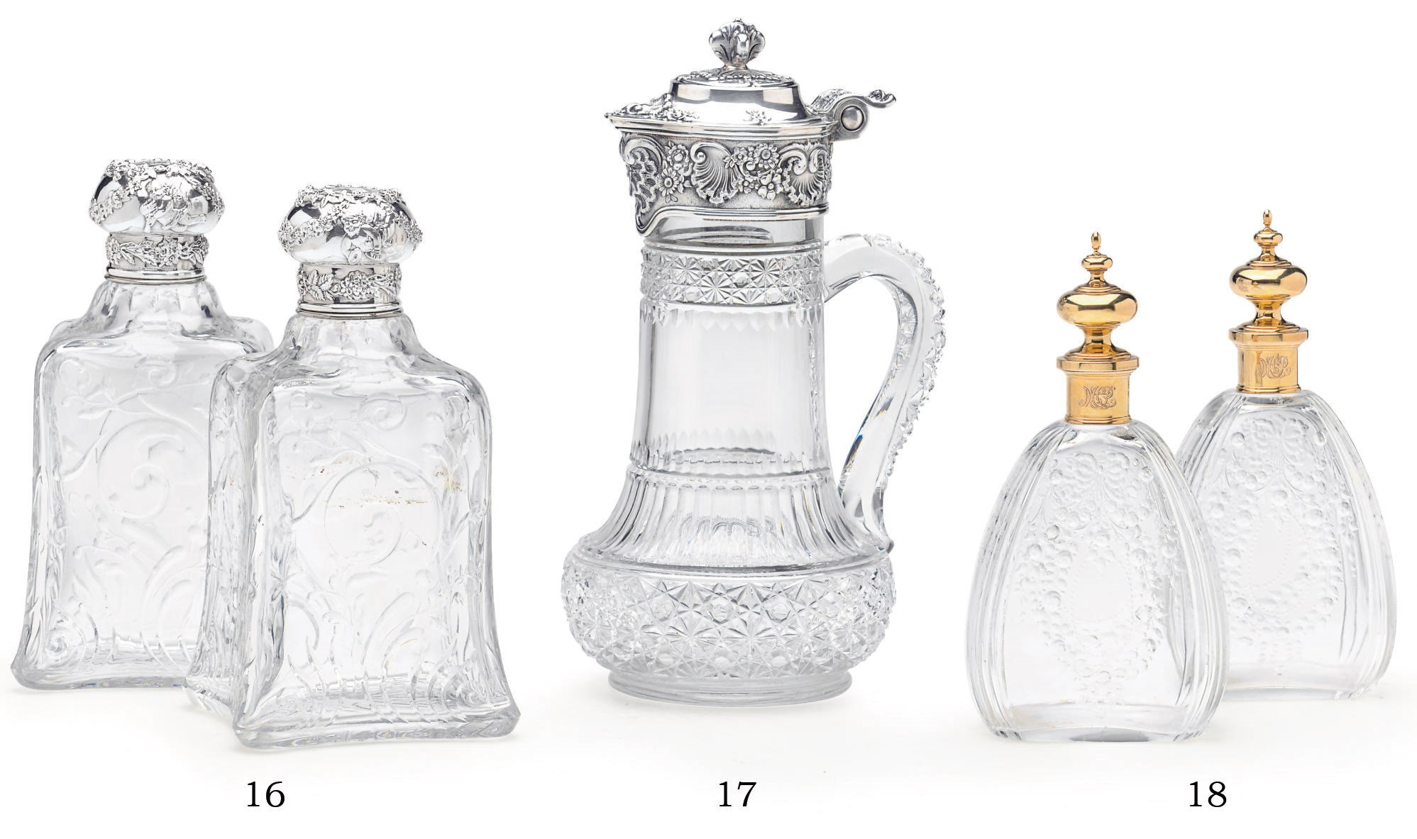 A PAIR OF CUT-GLASS SILVER-MOUNTED BOTTLES