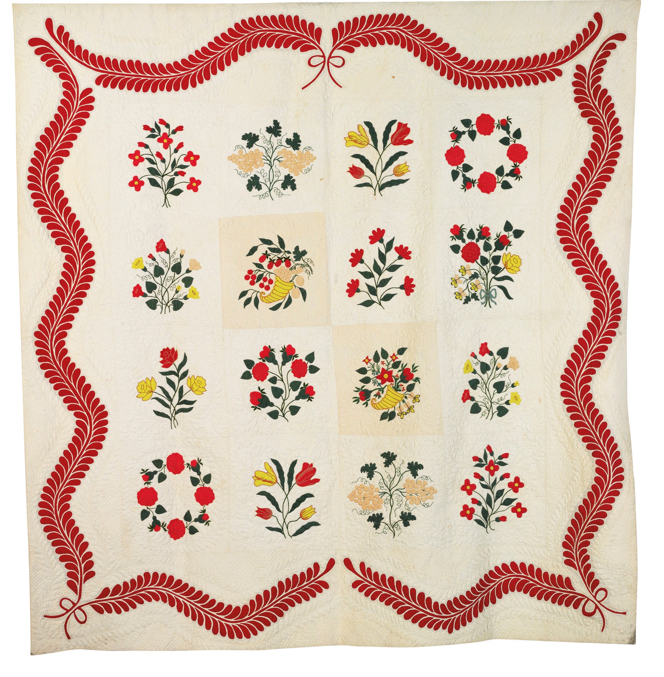 A PIECED AND APPLIQUED QUILTED COTTON COVERLET