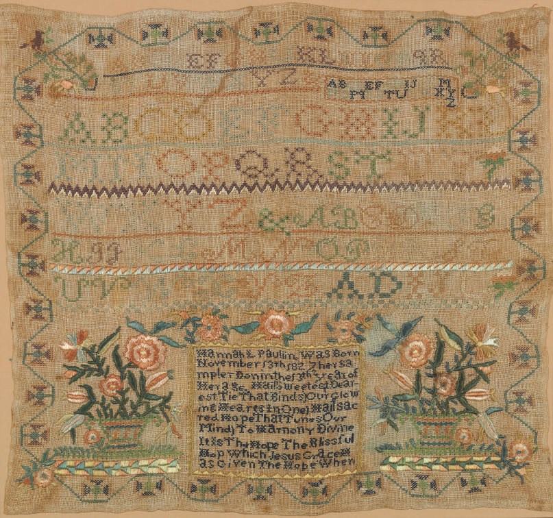 A SILK ON LINEN NEEDLEWORK SAMPLER