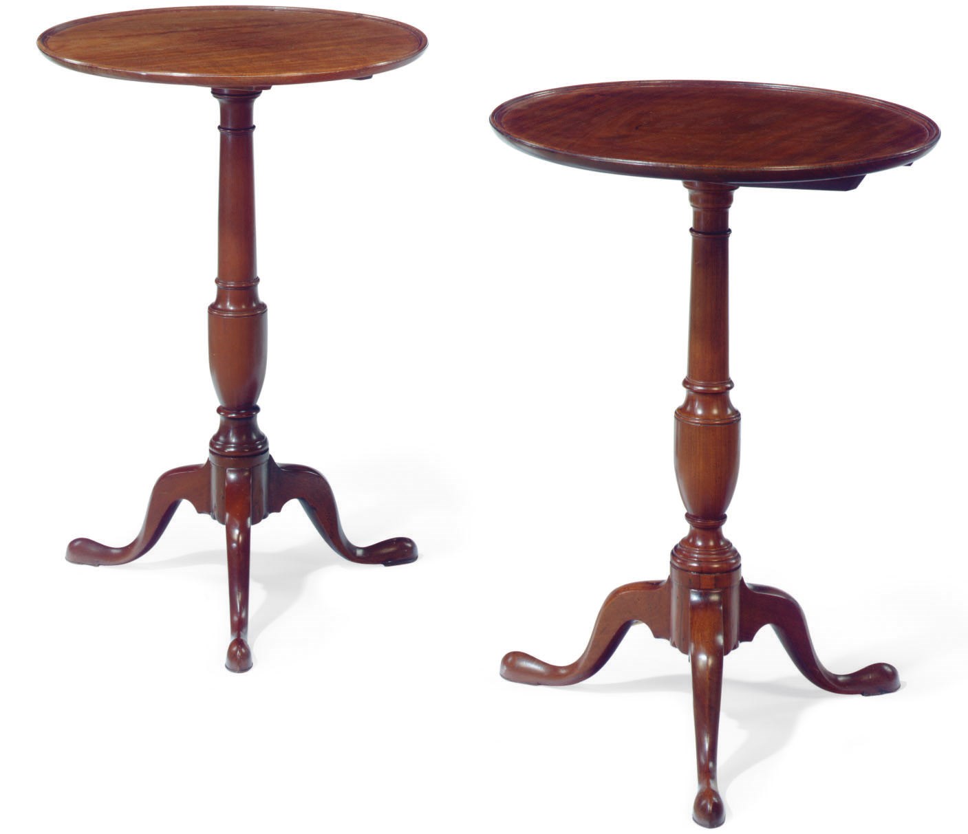 TWO SIMILAR CHIPPENDALE MAHOGANY TILT-TOP DISH-TOP CANDLESTANDS