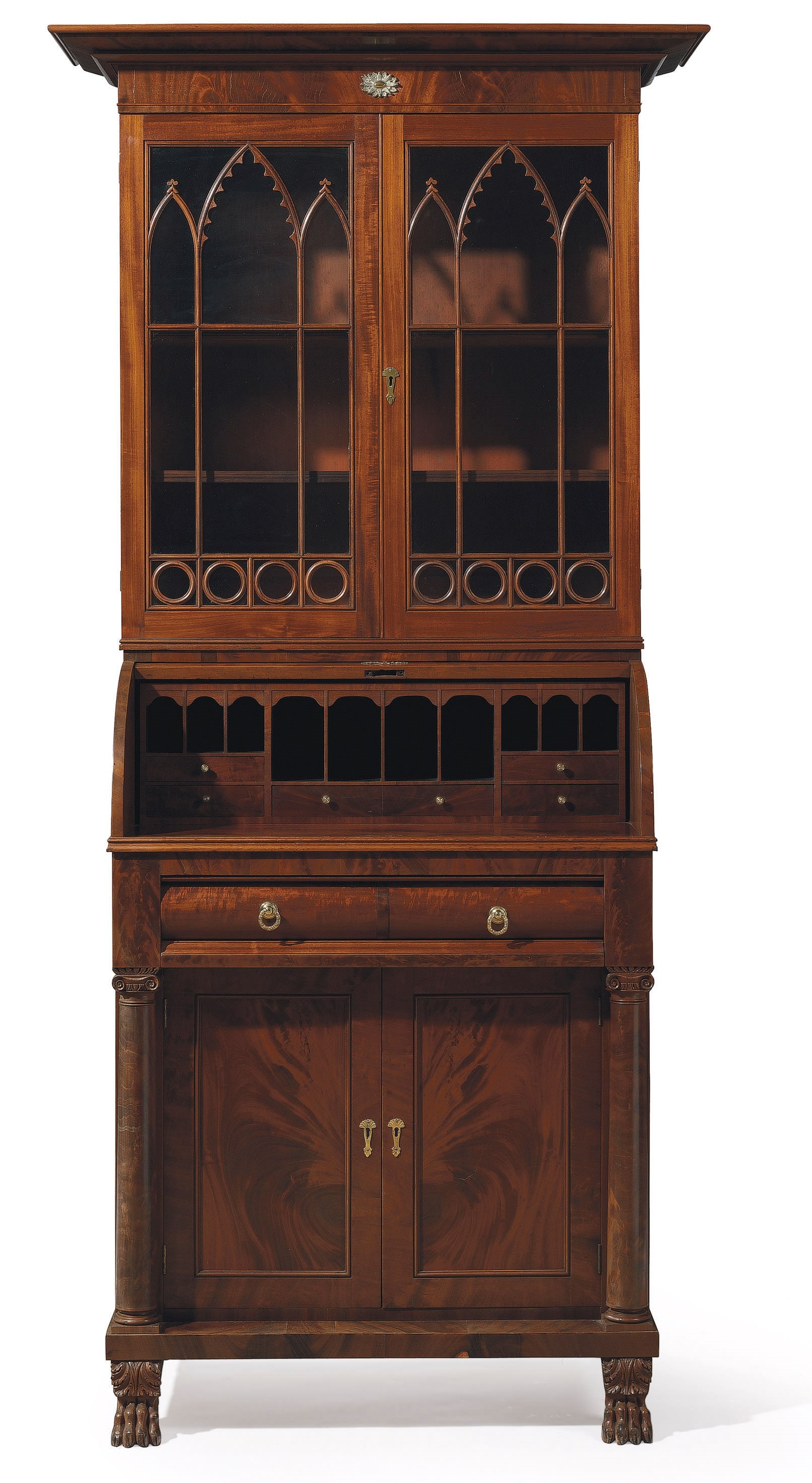 A CLASSICAL CARVED AND FIGURED MAHOGANY DESK-AND-BOOKCASE