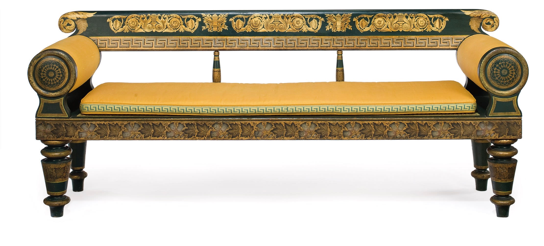 A CLASSICAL GREEN-PAINTED AND STENCIL-DECORATED CANE-SEAT SETTEE