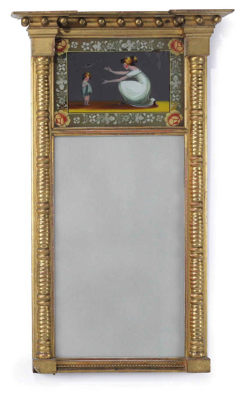A CLASSICAL GILTWOOD AND EGLOMISE LOOKING GLASS