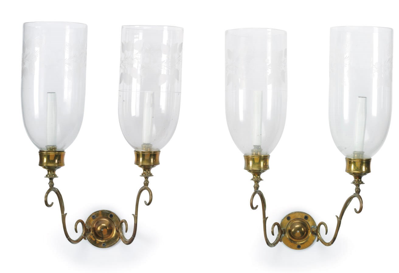 A PAIR OF GEORGIAN STYLE TWO-LIGHT BRASS WALL SCONCES