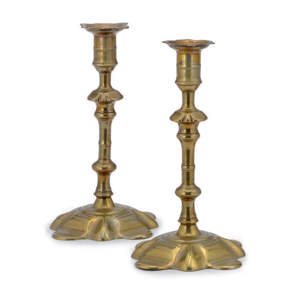 A PAIR OF GEORGE II BRASS CANDLESTICKS