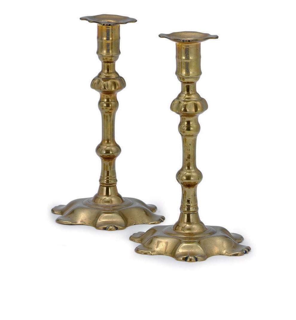 A PAIR OF GEORGE II BRASS CANDLESTICKS