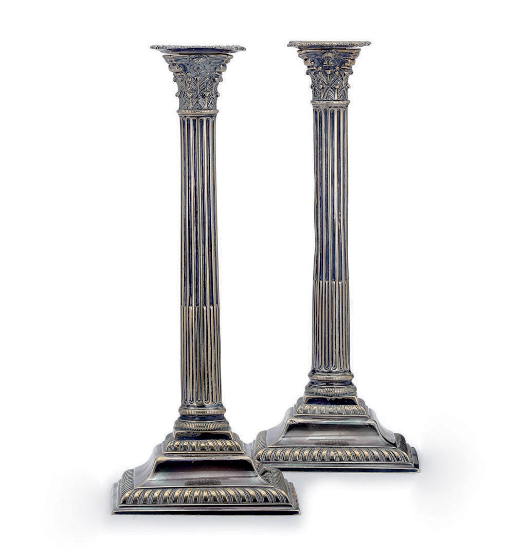 A PAIR OF GEORGE III SILVERED-BRASS COLUMNAR-FORM CANDLESTICKS