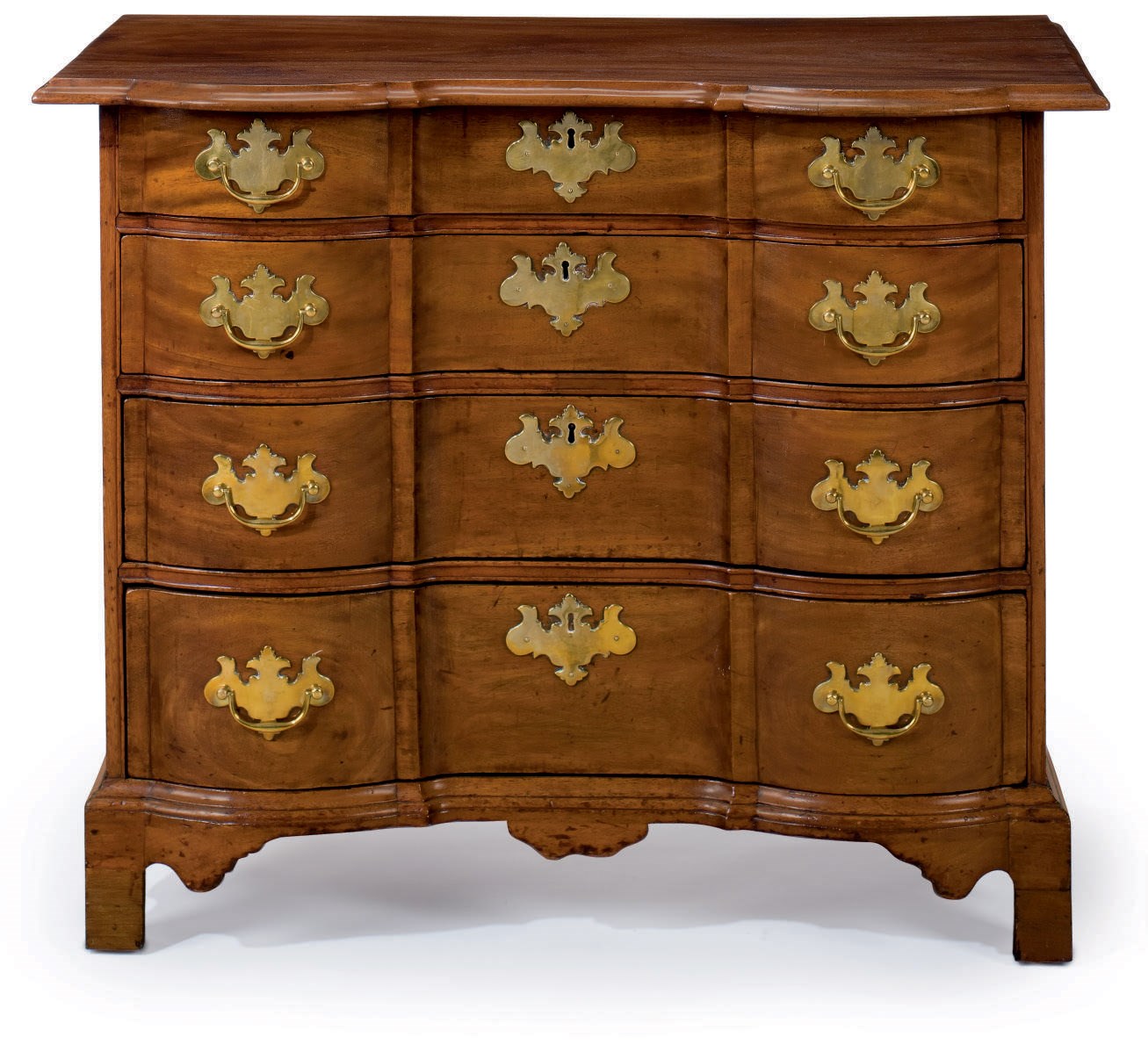 A QUEEN ANNE FIGURED MAHOGANY BLOCK-FRONT CHEST-OF-DRAWERS