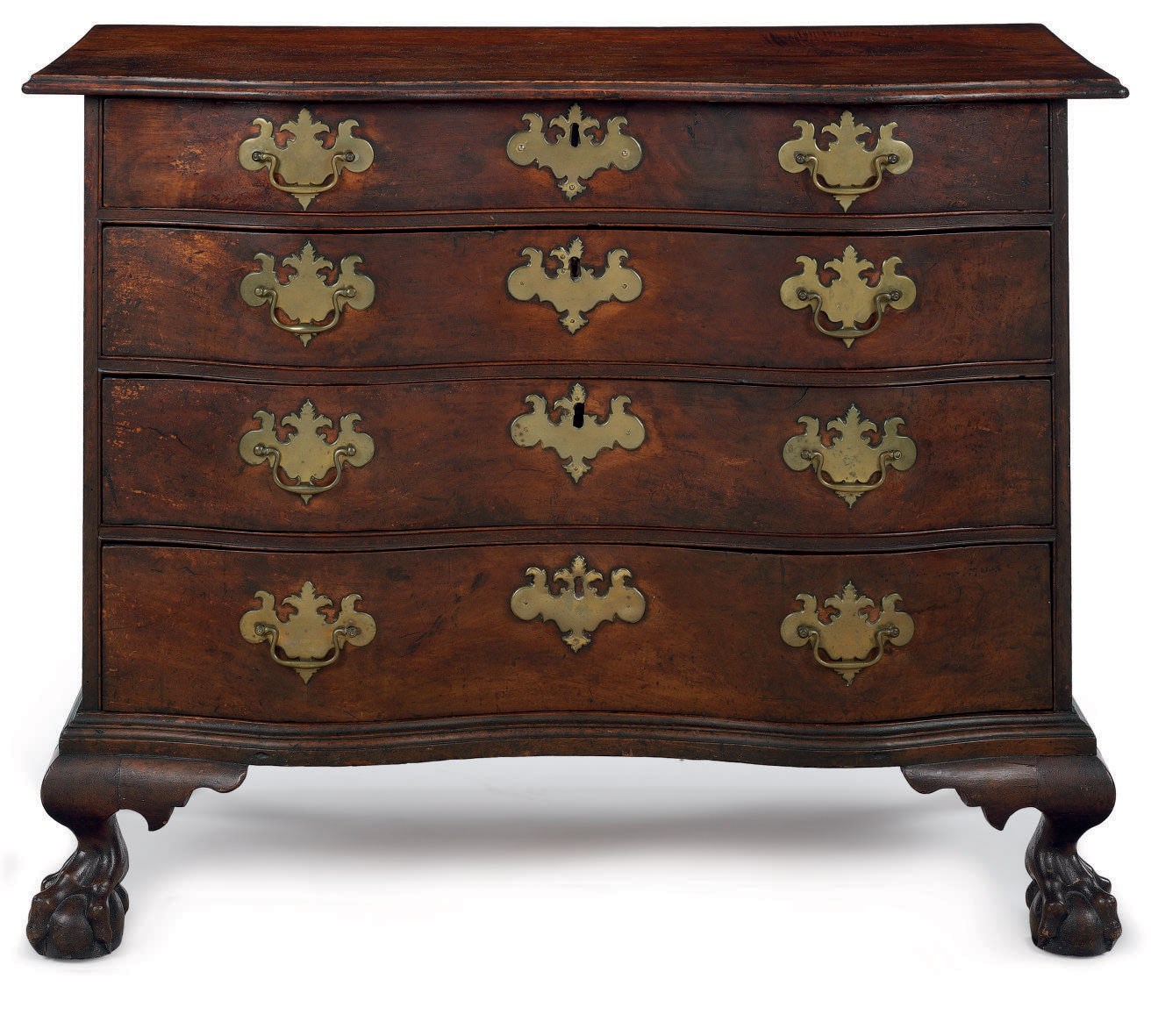 A CHIPPENDALE MAHOGANY REVERSE-SERPENTINE CHEST-OF-DRAWERS