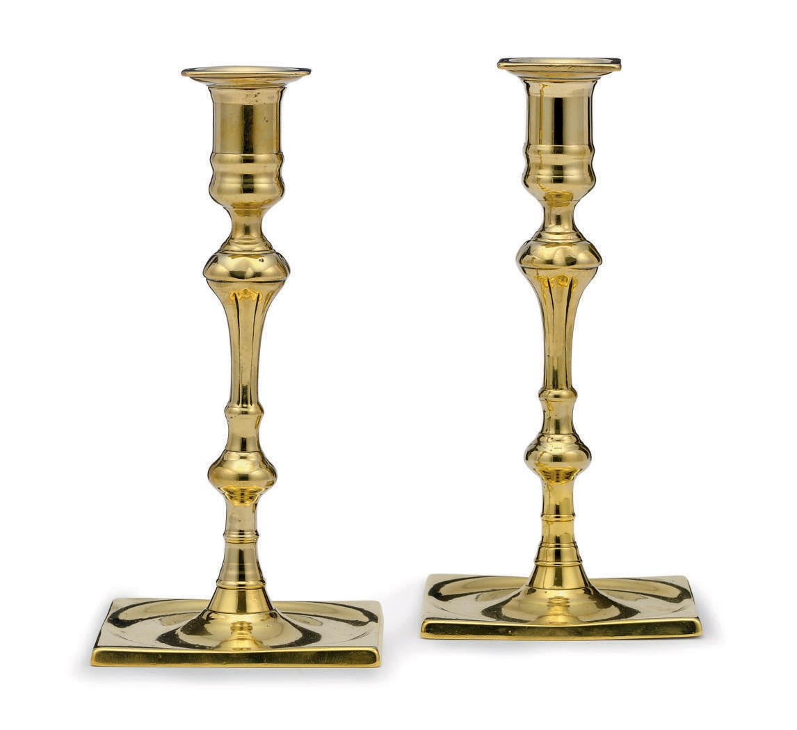 A PAIR OF GEORGE II BRASS CANDLESTICKS