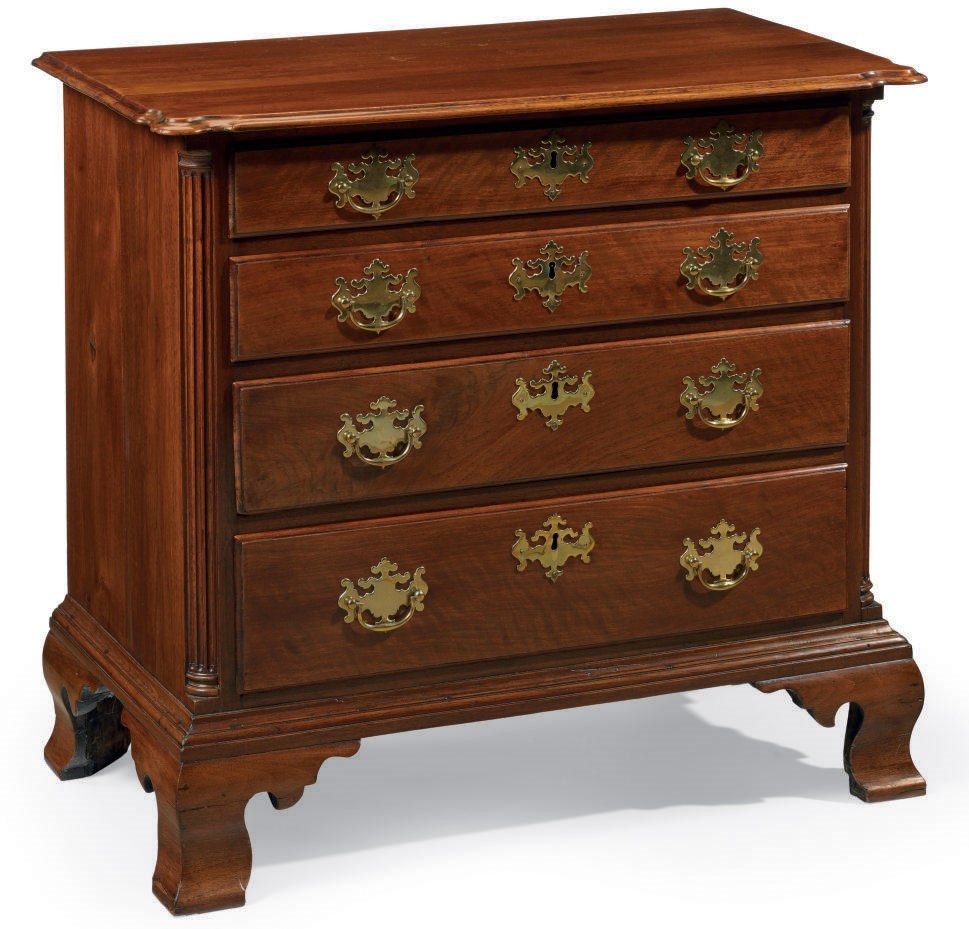 A CHIPPENDALE FIGURED WALNUT CHEST-OF-DRAWERS