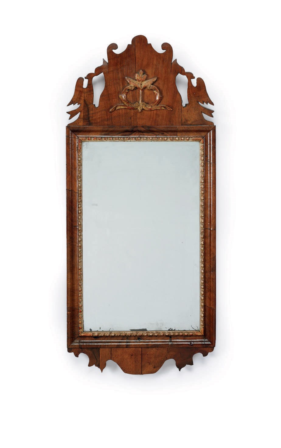 A PARCEL-GILT WALNUT LOOKING GLASS