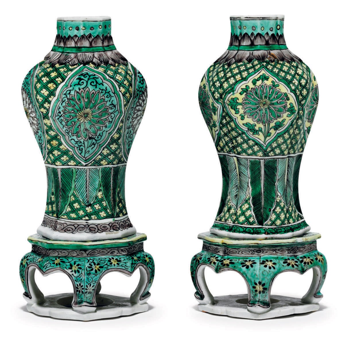 A PAIR OF BISCUIT-GLAZED VASES AND STANDS
