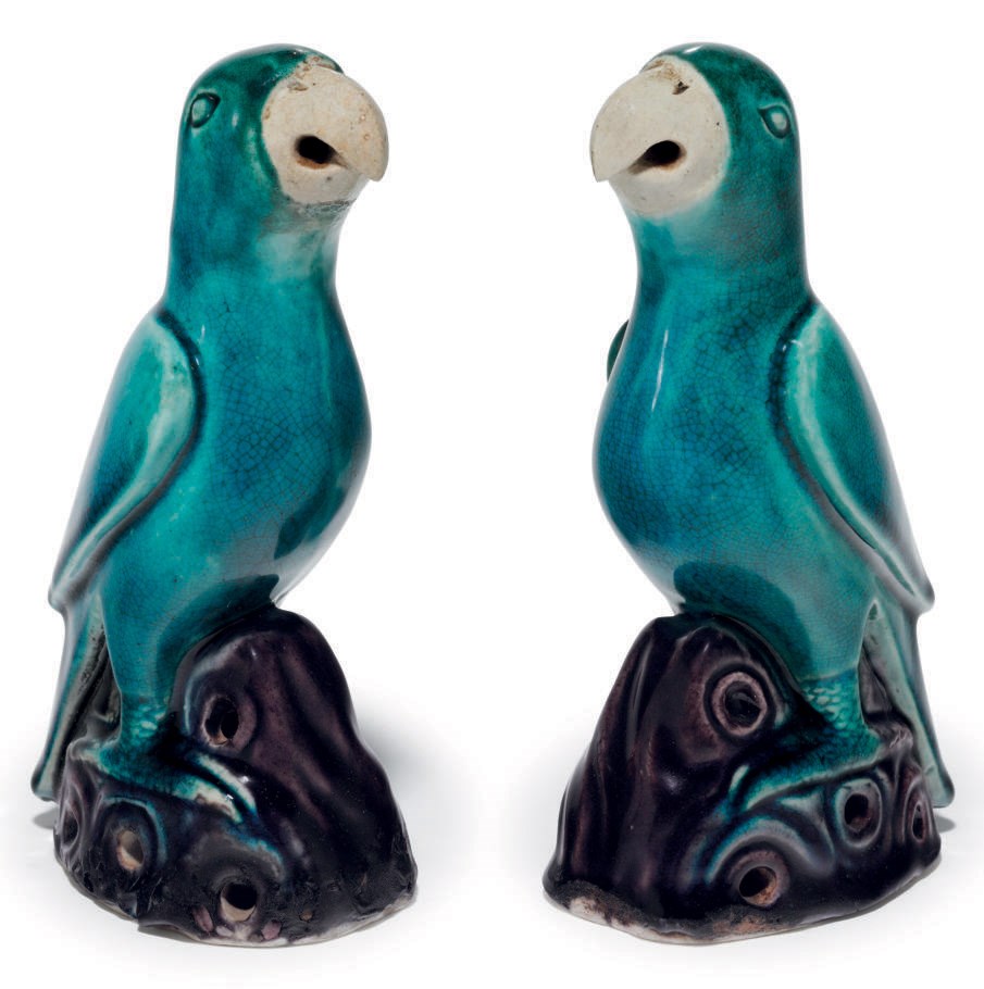 A SMALL PAIR OF TURQUOISE AND AUBERGINE PARROTS