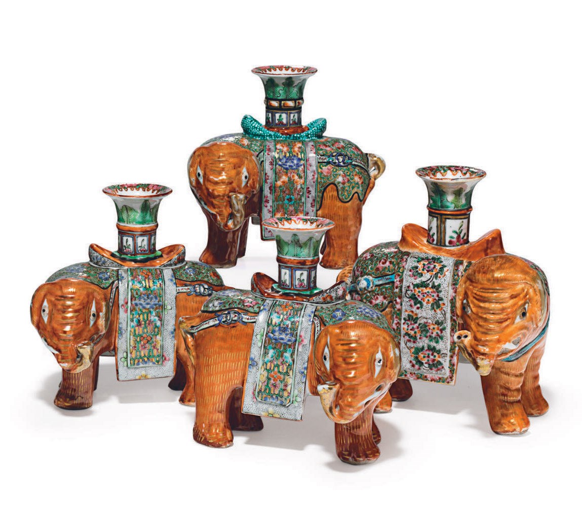 A GROUP OF FOUR ELEPHANT CANDLEHOLDERS
