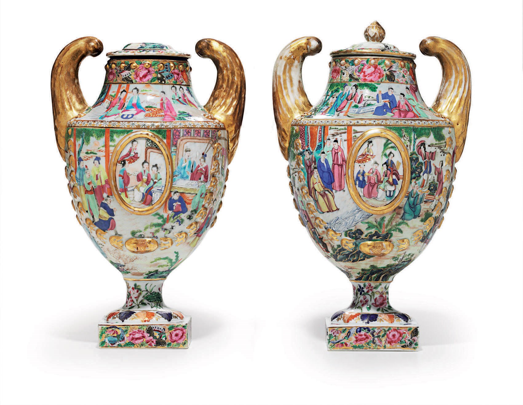 A PAIR OF "CANTON FAMILLE ROSE" URNS AND COVERS