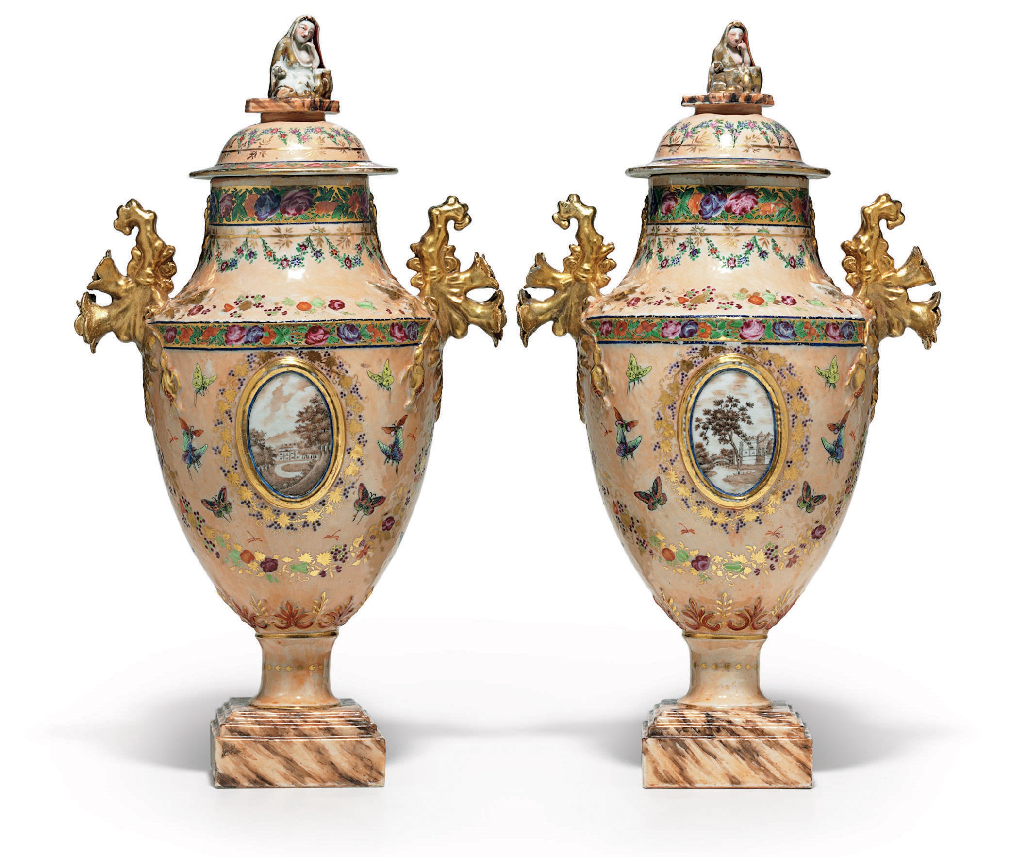 A PAIR OF PEACH-GROUND URNS AND COVERS