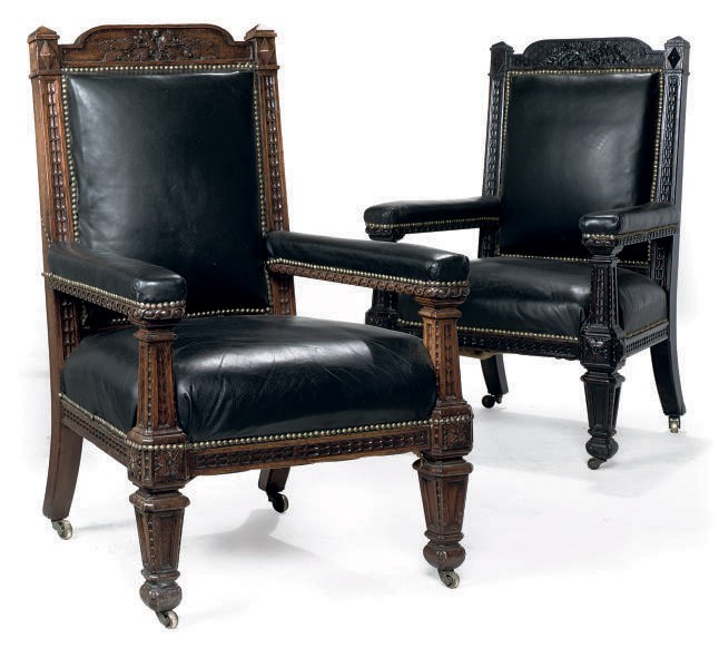 TWO SIMILAR LATE VICTORIAN CARVED OAK ARMCHAIRS