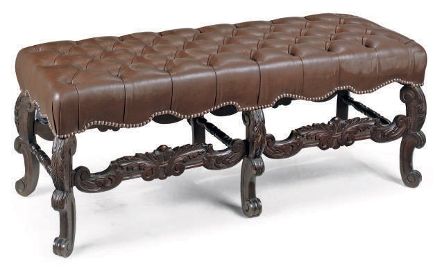 A NORTH EUROPEAN CARVED STAINED MAHOGANY LONG STOOL