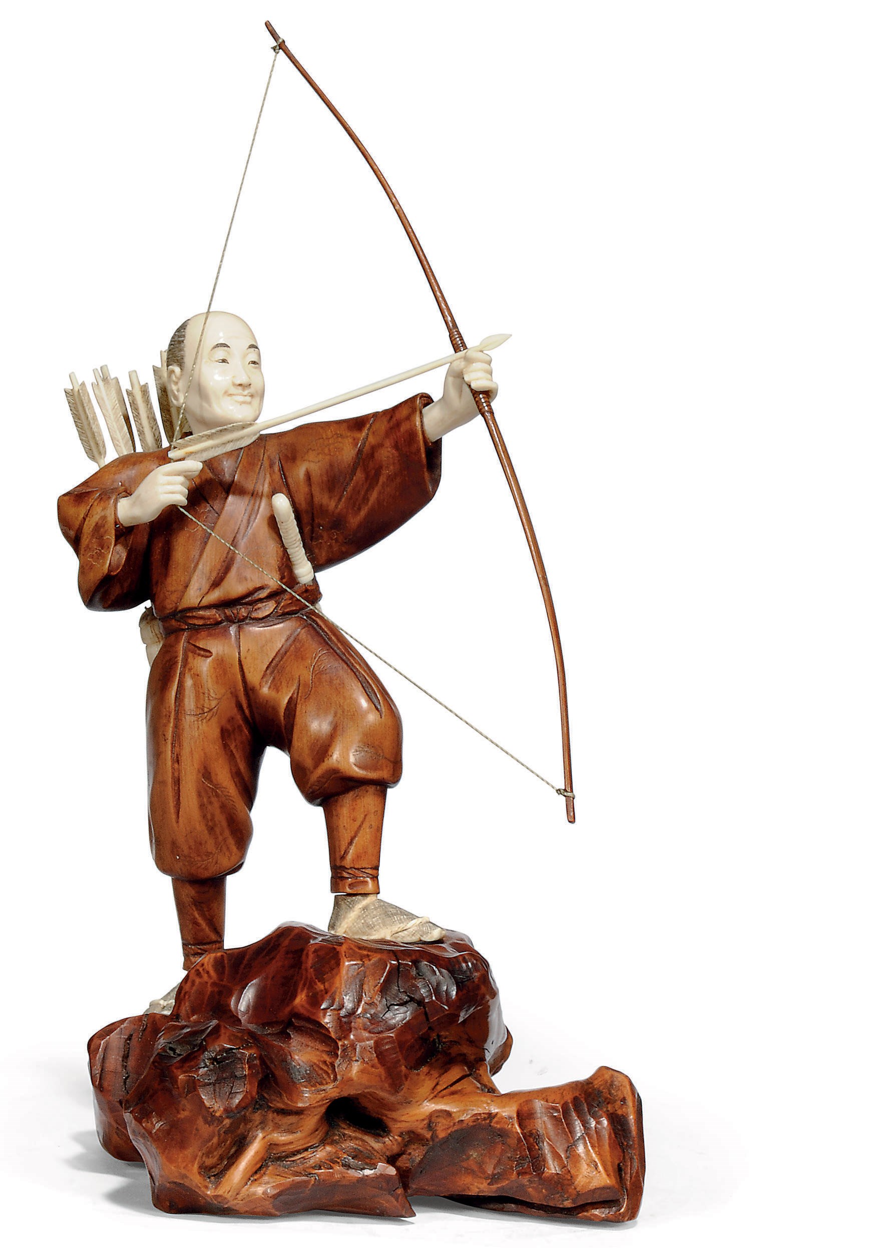 A JAPANESE IVORY AND WOOD OKIMONO OF AN ARCHER, SIGNED